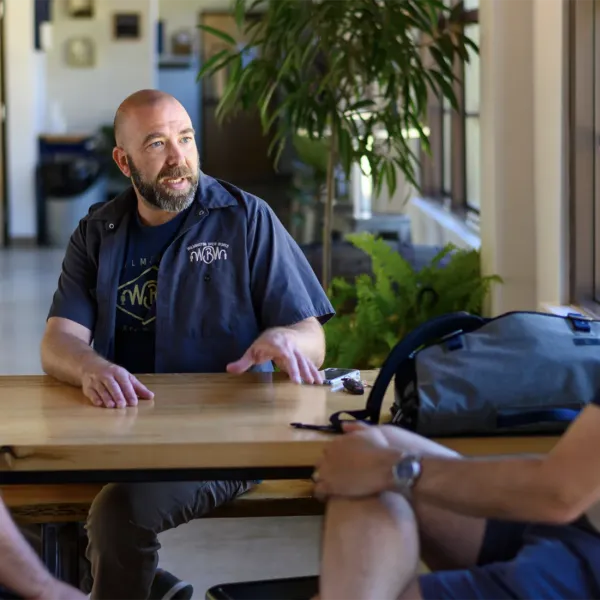 men talking at table in Delaware